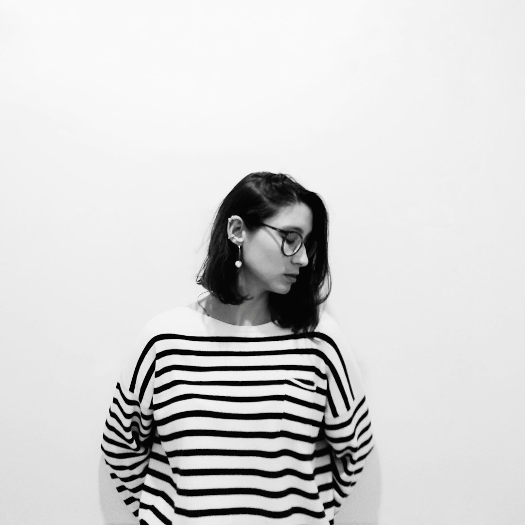 Professional woman with glasses in studio portrait