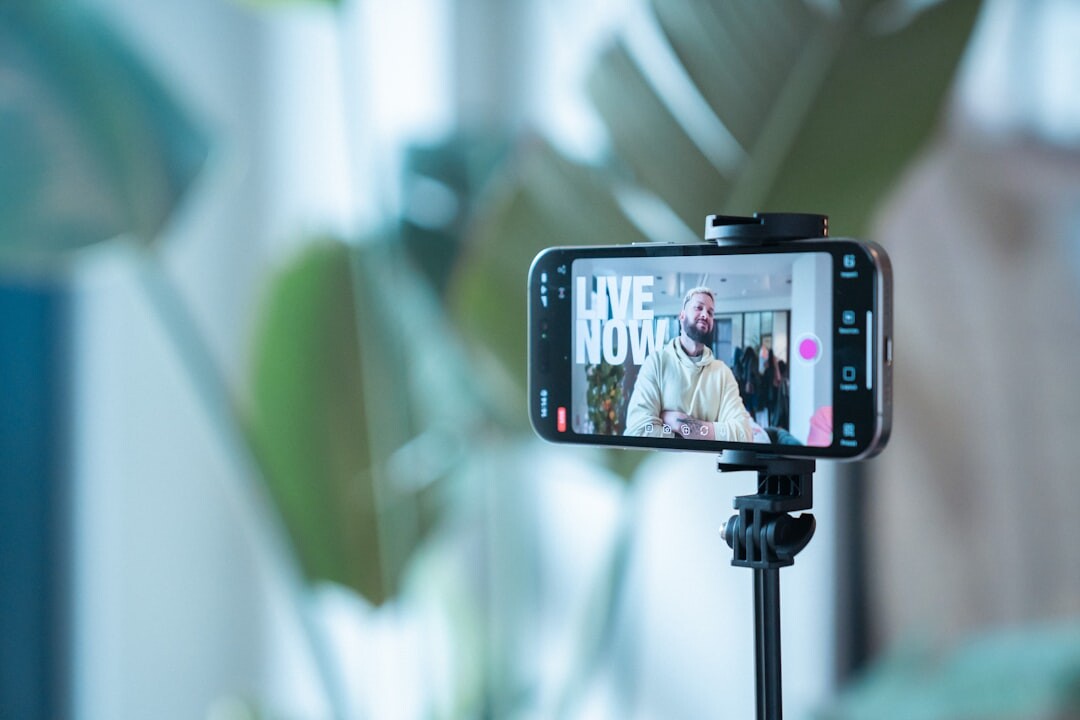 Content creator filming a short video with a smartphone on a tripod